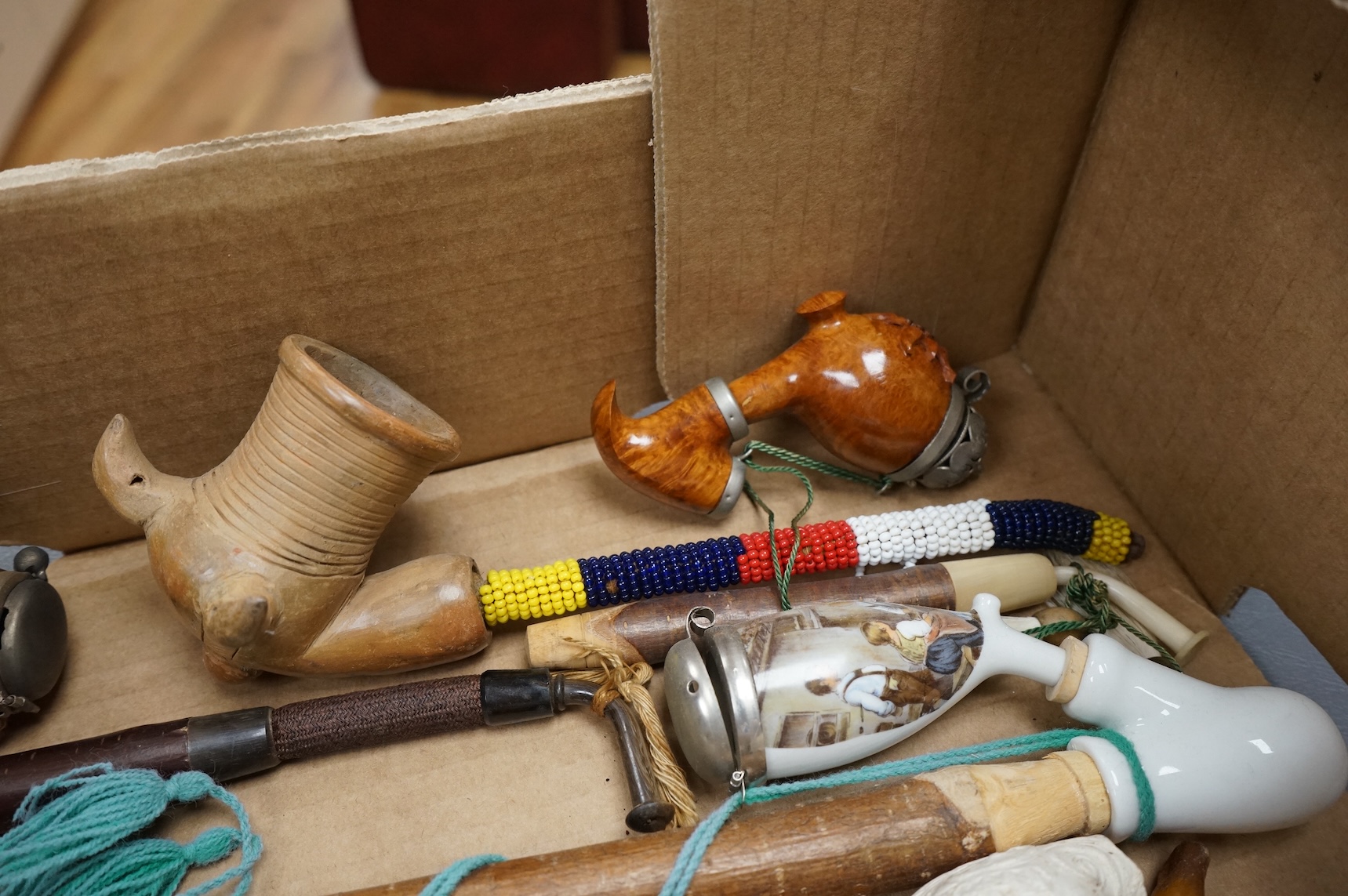 A group of fifteen novelty pipes to include treen, clay and ceramic examples